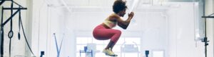 Woman jumping at gym
